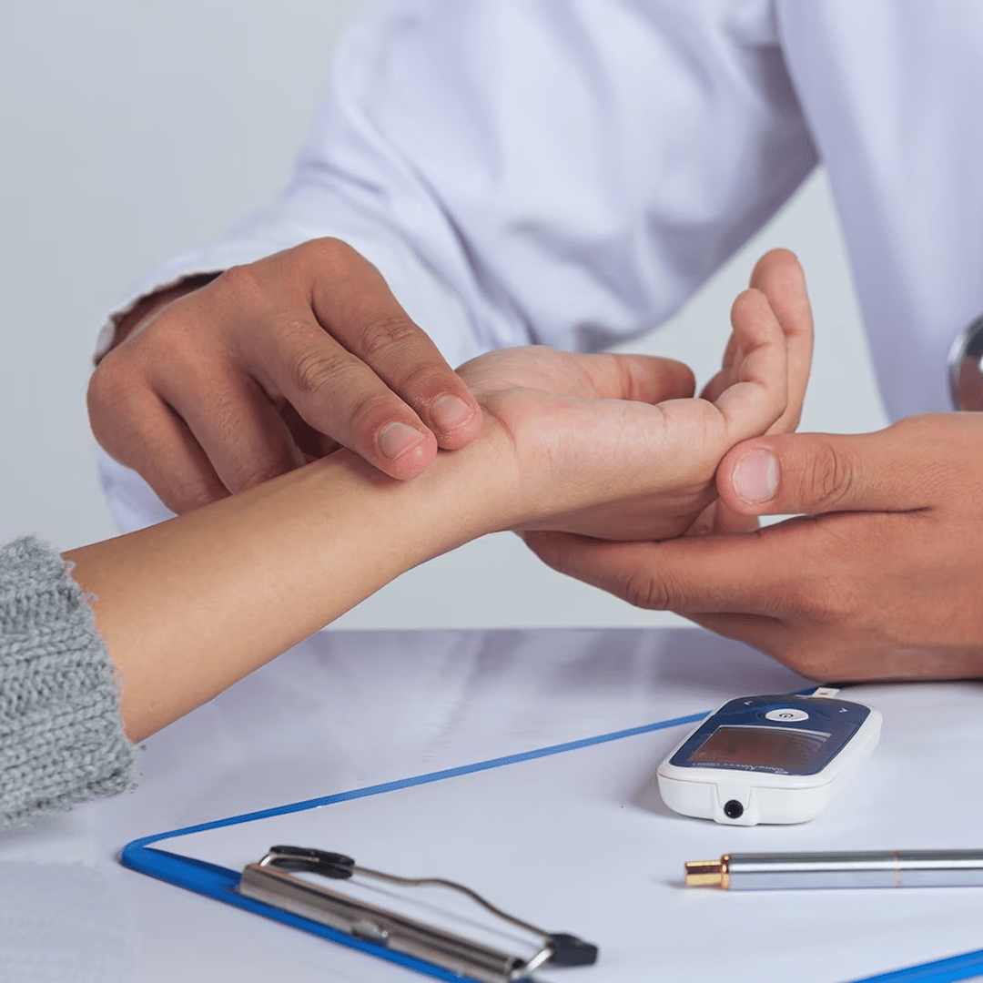 Doctor checking the pulse of the patient by placing two fingers on the wrist